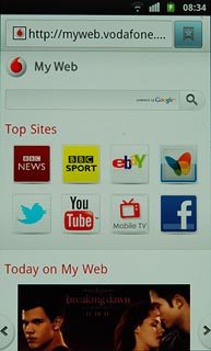 Press the address bar at the top of the display.