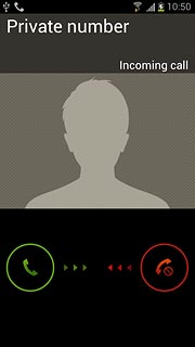 When you have an ongoing call, the new call is signalled by a sound.Press and drag the accept call icon right.